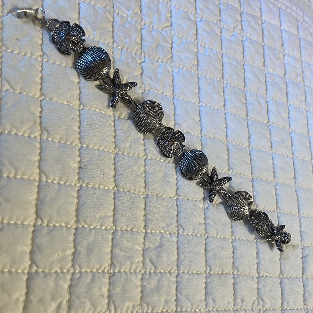 Solid Sterling Sea Life Bracelet - Fearuring Starfish, Shells, & Sanddollars.